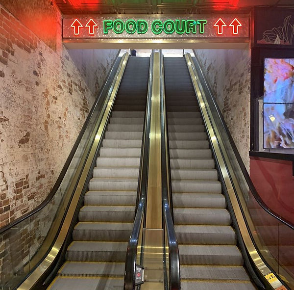 Escalators Leading Up to Dirt Dog at Showcase Mall Food Court