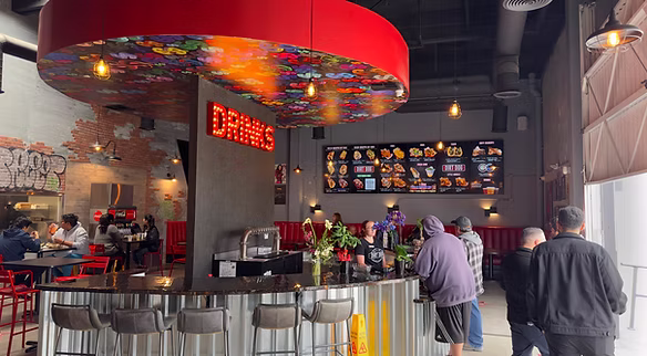 Interior View of Dirt Dog Commerce Restaurant with Decor and Counter